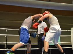 Steven Ware (blue gloves) boxing an opponent 