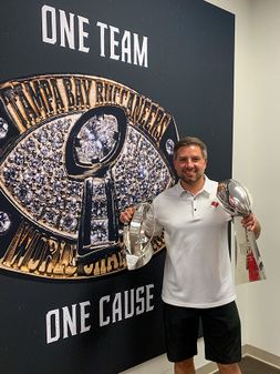 Michael holding superbowl trophies