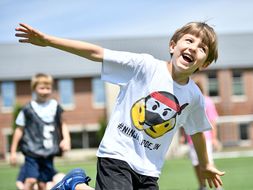 Active child runs on recreation field.