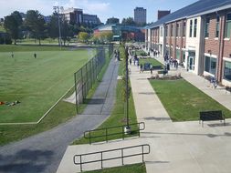 The College of Physical Activity and Sport Sciences during a sunny school day. 