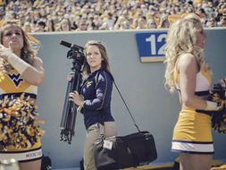 Videographer at football game