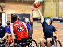 Players fight for ball during wheelchair basketball