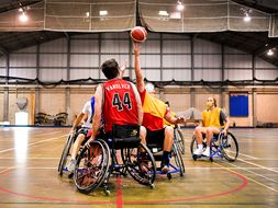 A tipoff during wheelchair basketball