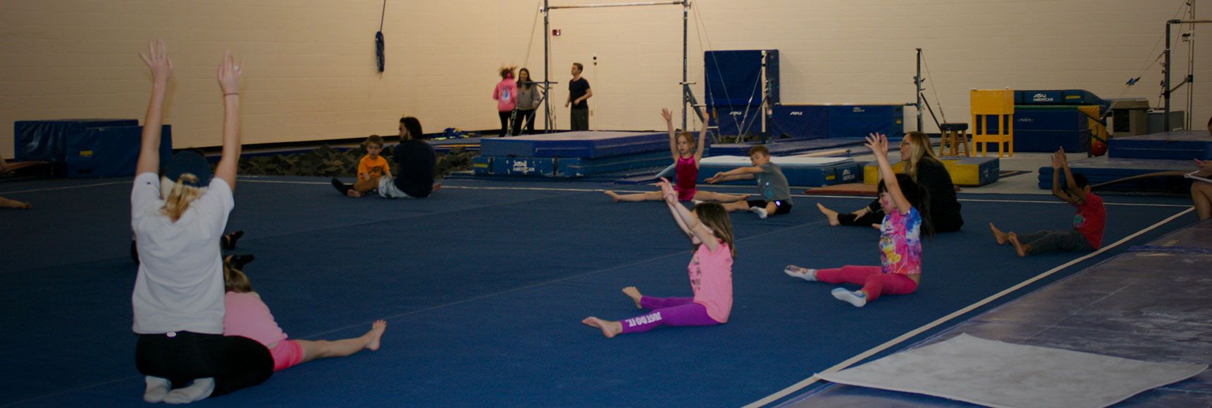 Students stretching for gymnastics class