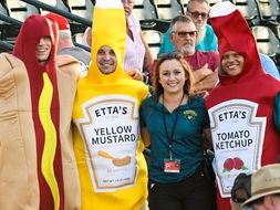 Riggleman poses with people in hotdog, mustard and ketchup costumes