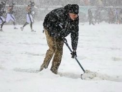Stephen Weingarten shoveling snow