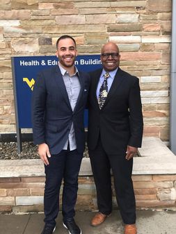 Alex Brucki (left) and Floyd Jones (right) standing in front of CPASS building.