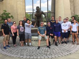 Photo of students in front of Jerry West statue in Morgantown, WV.