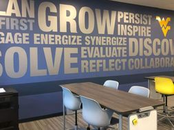 An inspiring typographic mural on the back wall of the Active Learning Center