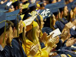 Students clapping during commencement