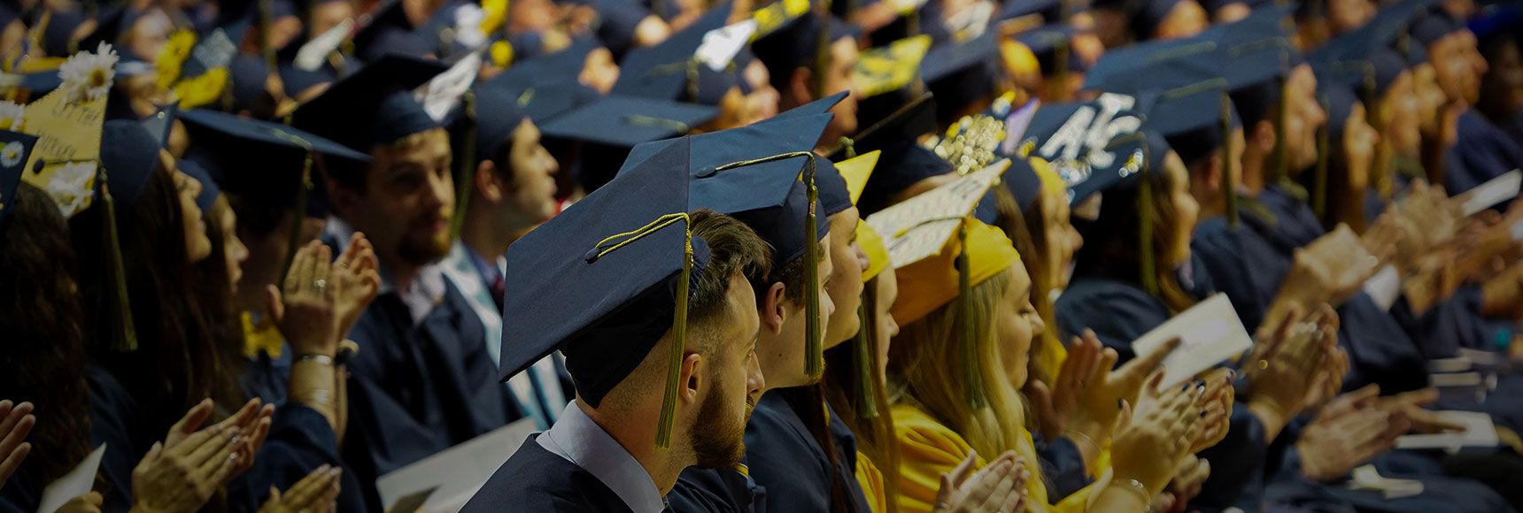 Students clapping during commencement