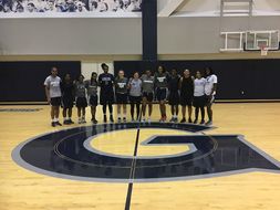 Abby Reid pictured with the Georgetown women's basketball team.